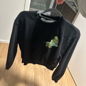 Off-white cropped crew neck with plants around logo